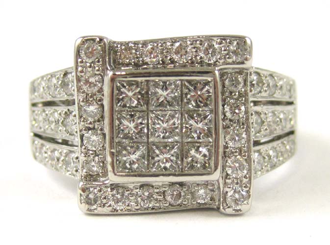 Appraisal: DIAMOND AND FOURTEEN KARAT WHITE GOLD RING set with nine