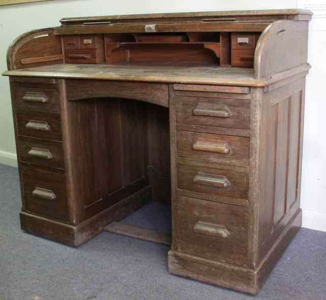 Appraisal: An American roll top desk fitted drawers beneath the tambour