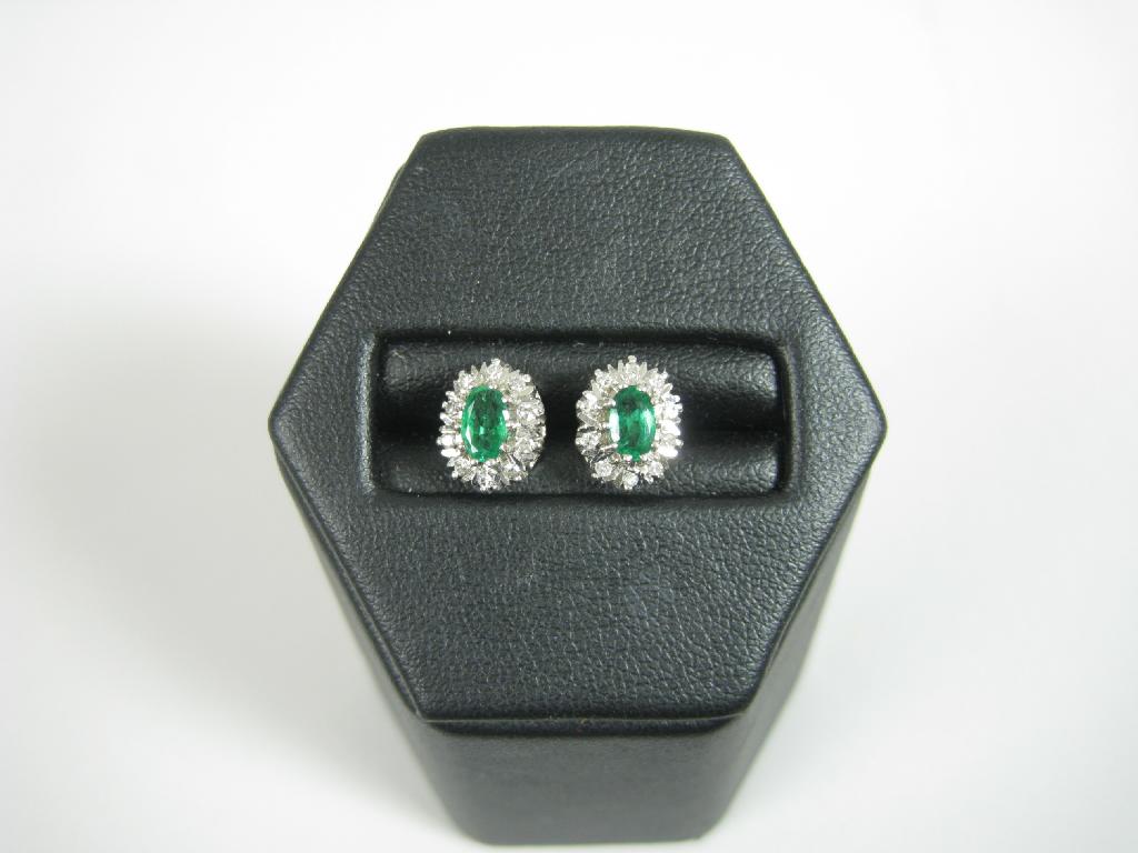 Appraisal: A pair of Emerald and Diamond Ear Studs each with