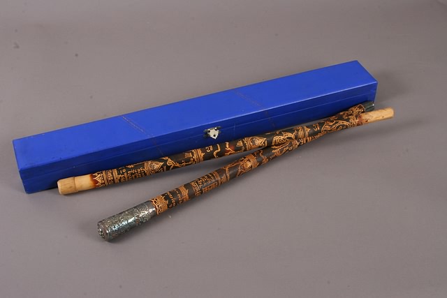 Appraisal: Pair of swagger sticks one featuring silver end caps Sticks