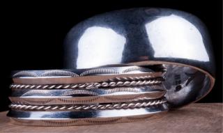 Appraisal: Southwestern Sterling Cuff Bracelets Pair One classic with twisted wire