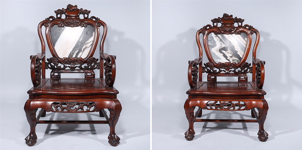 Appraisal: Two Chinese carved hardwood chairs with allover designs and marble