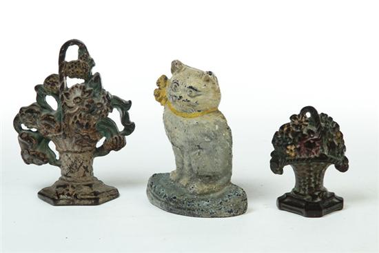 Appraisal: THREE DOORSTOPS American cast iron early th century Seated cat