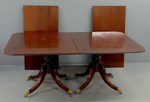 Appraisal: Duncan Phyfe style dining table with down-swept legs and brass