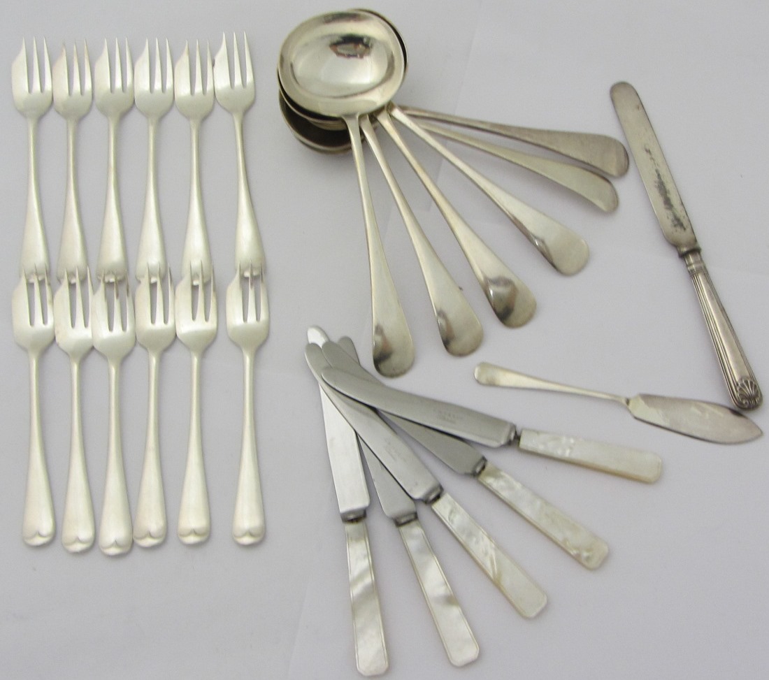 Appraisal: Ten silver coffee spoons the handles cast with scrolling decoration