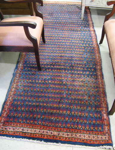 Appraisal: PERSIAN MIR RUNNER the blue ground covered with repeating rows