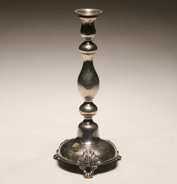 Appraisal: German silver candlestick on tripod leaf and branch form feet