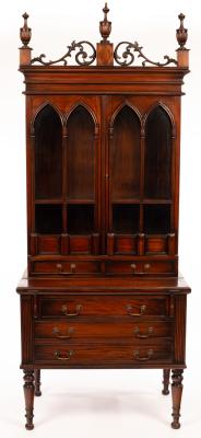 Appraisal: A Victorian style mahogany bookcase with three reeded urn finials