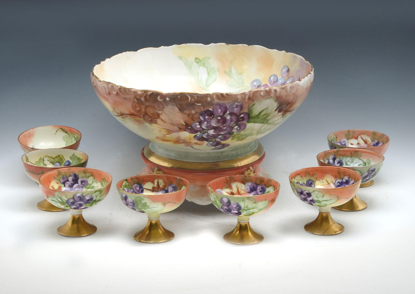 Appraisal: HAND PAINTED BAVARIAN PUNCH BOWL SET Comprising Large Austrian punch