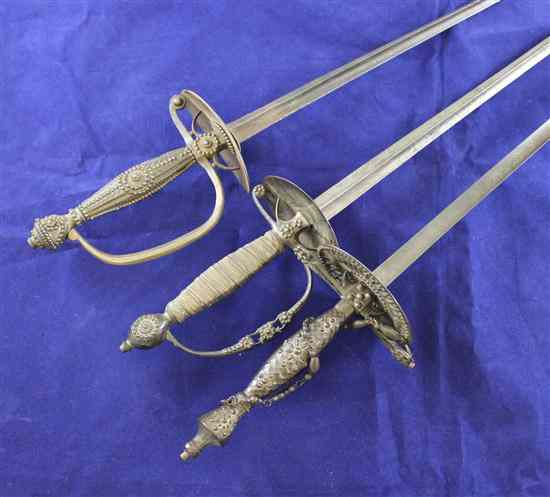 Appraisal: Three th century cut steel dress swords longest ins Estimate