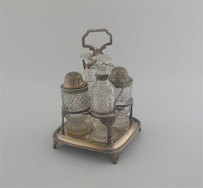 Appraisal: A George III four bottle cruet frame with a gadrooned