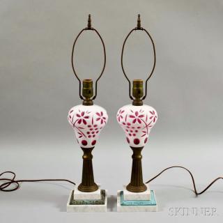 Appraisal: Pair of White Cut-to-pink Glass Fluid Lamps th century electrified