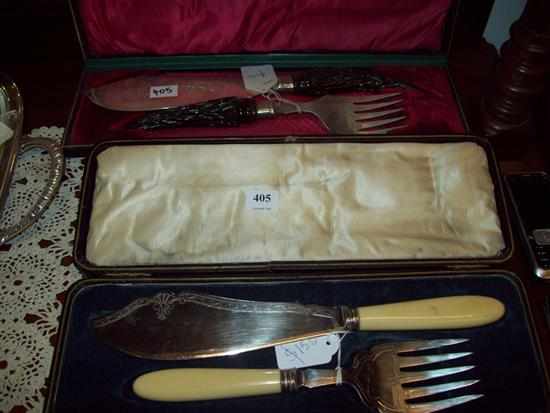 Appraisal: TWO PAIRS OF FISH SERVING KNIVES AND FORKS IN PRESENTATION