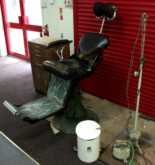 Appraisal: A dentist's chair circa and a quantity of dentist's implements