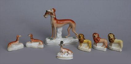 Appraisal: SEVEN STAFFORDSHIRE ANIMAL FIGURES Comprising a whippet with hare in