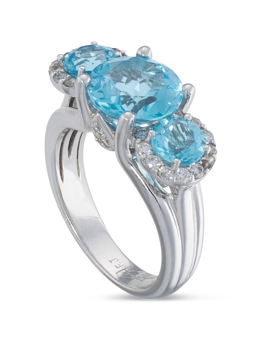 Appraisal: BLUE TOPAZ DIAMOND AND KT WHITE GOLD THREE-STONE RING APPROX