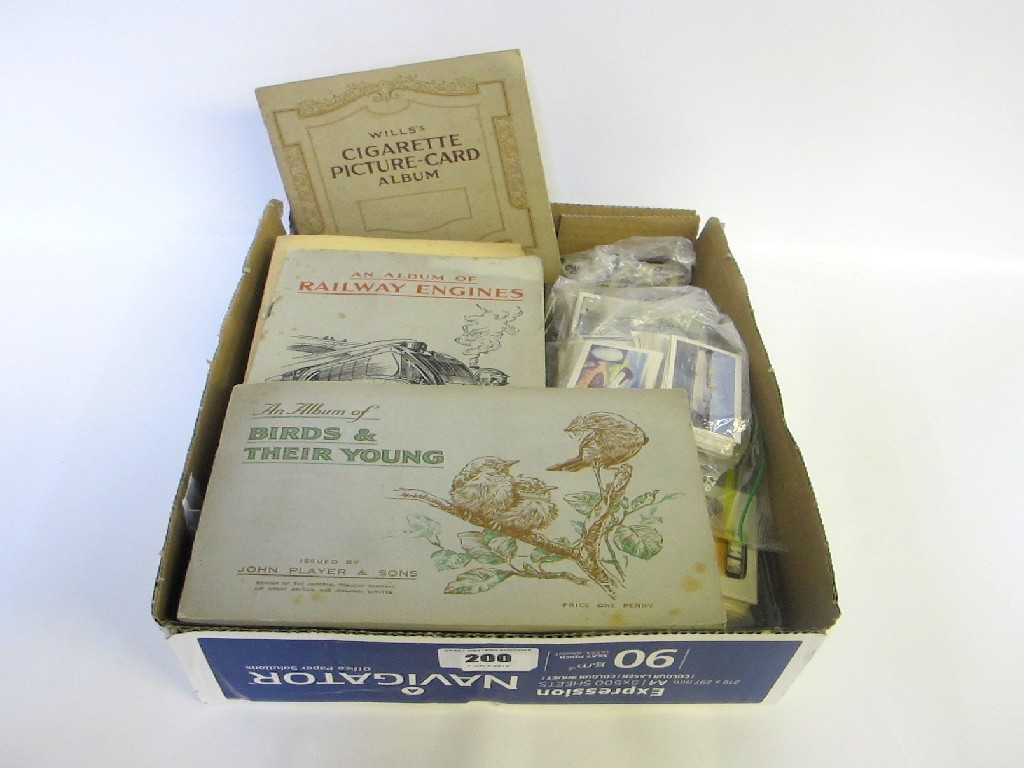 Appraisal: A box of albums of cigarette cards and a quantity