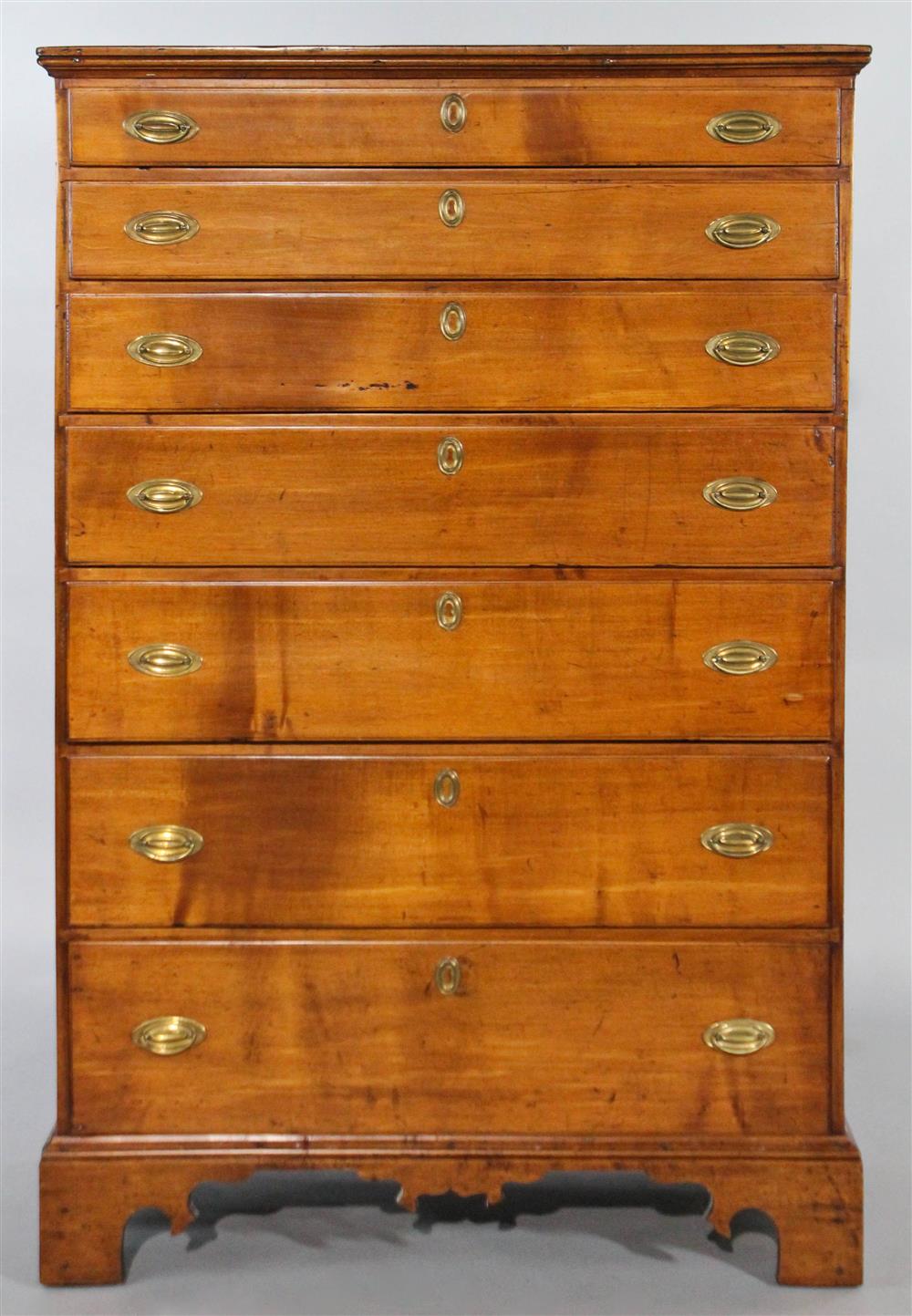 Appraisal: AMERICAN CHERRYWOOD GENTLEMAN'S TALL CHEST OF DRAWERS having a rectangular