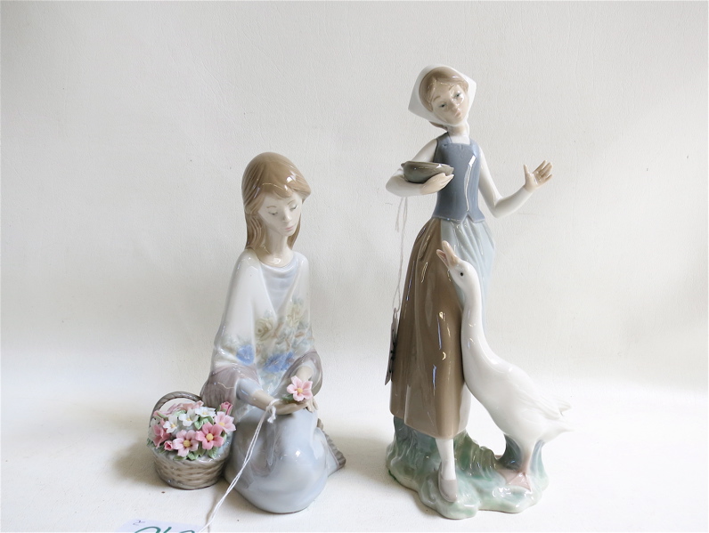 Appraisal: TWO LLADRO PORCELAIN FIGURINES Girl with Duck sculptor Vicente Martinez