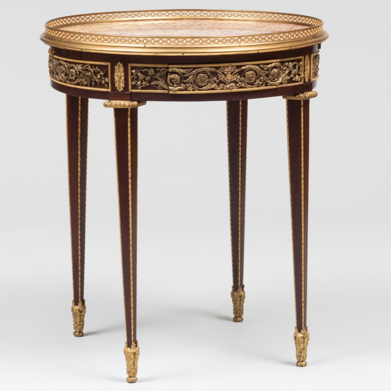 Appraisal: LOUIS XVI STYLE GILT-BRONZE-MOUNTED MAHOGANY BOUILLOTTE TABLE Fitted with two