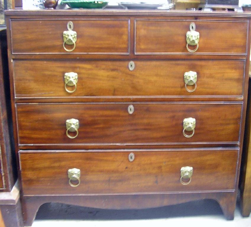 Appraisal: A George III mahogany chest of drawers with brass lion