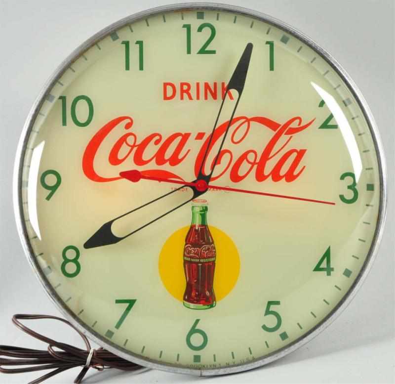 Appraisal: s Coca-Cola PAM Electric Light-Up Clock Description Nice clean bright