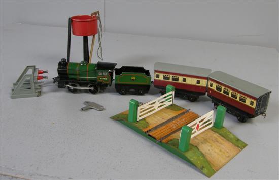 Appraisal: Hornby Meccano Type clockwork steam engine two carriages Buffer stop