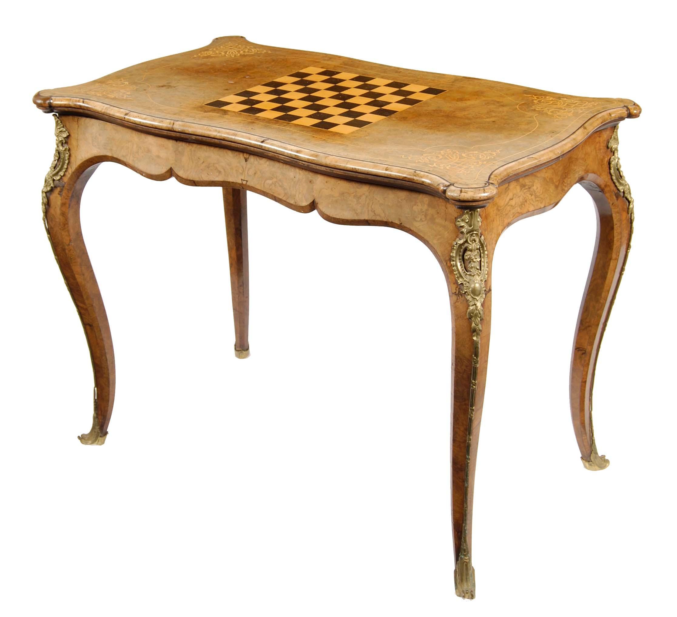 Appraisal: A Victorian burr walnut and gilt brass mounted games table