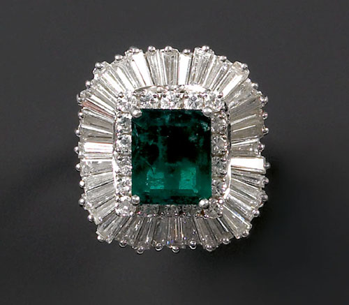 Appraisal: Emerald and diamond ring in a platinum setting with center