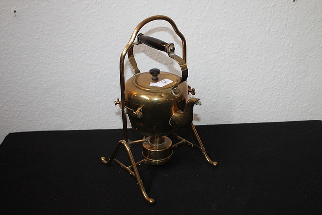 Appraisal: AN ARTS AND CRAFTS STYLE BRASS SPIRIT KETTLE on stand