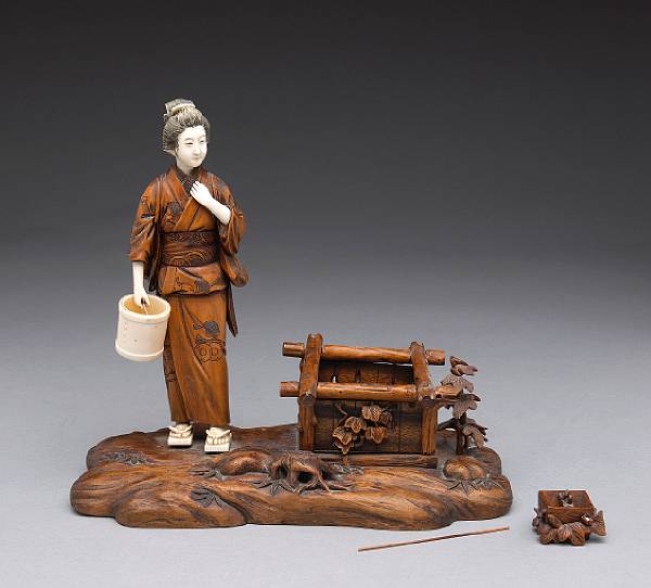 Appraisal: A mixed ivory and boxwood okimono Meiji Taisho Period Featuring