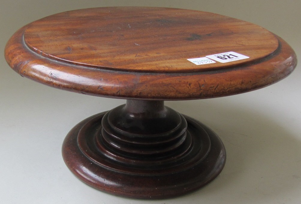 Appraisal: A th century mahogany Lazy Susan on turned socle cm