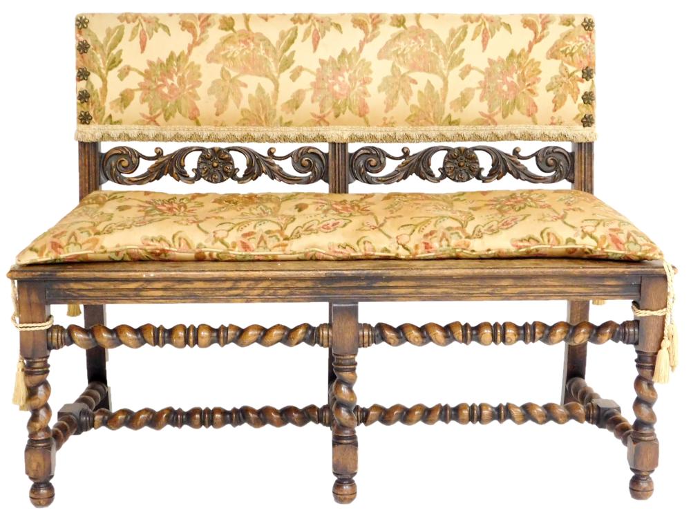 Appraisal: Renaissance style bench with upholstered back rest in tan floral