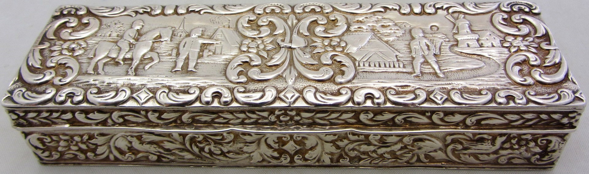 Appraisal: A rectangular hinge lidded box the cover embossed with two