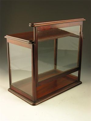 Appraisal: A th century mahogany display case with a rising ratcheted