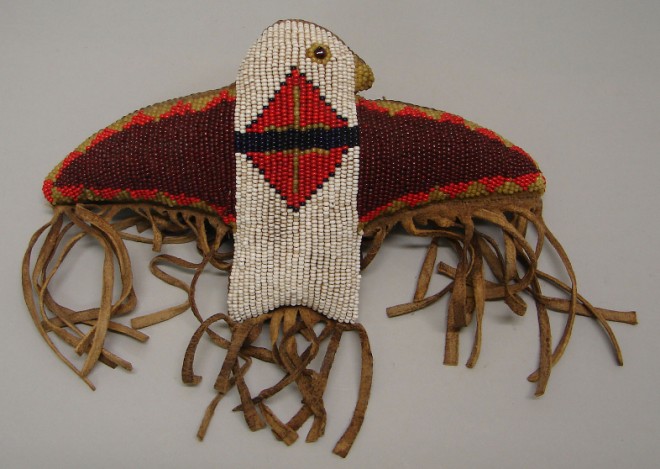 Appraisal: Beaded eagle features spread wings with colorful beads leather backing