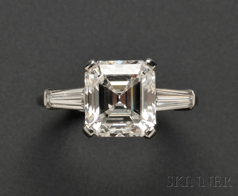 Appraisal: Platinum and Diamond Solitaire prong-set with a cut-corner square step-cut