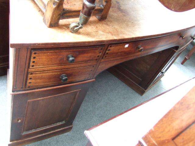 Appraisal: A th century mahogany and line inlaid angled pedestal desk