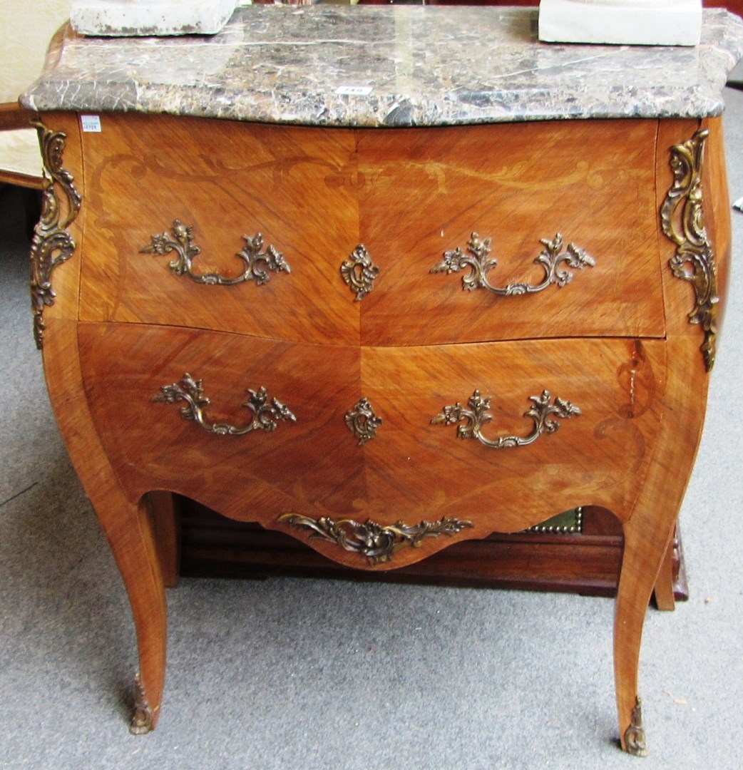 Appraisal: A Louis XV style commode the serpentine marble top over