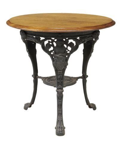 Appraisal: English cast iron pub table th c circular mahogany top