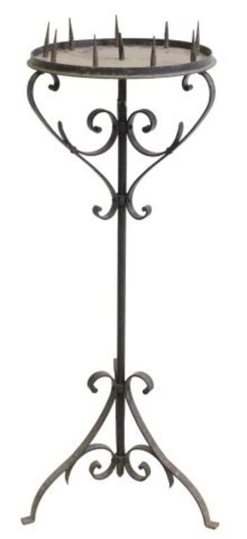 Appraisal: French wrought iron standing candlestick th c having circular top