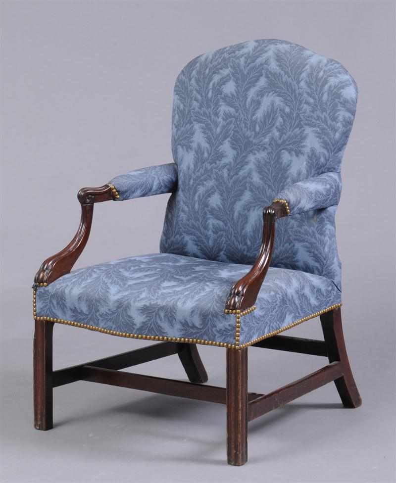 Appraisal: GEORGE III CARVED MAHOGANY LIBRARY ARMCHAIR With shaped upholstered backrest