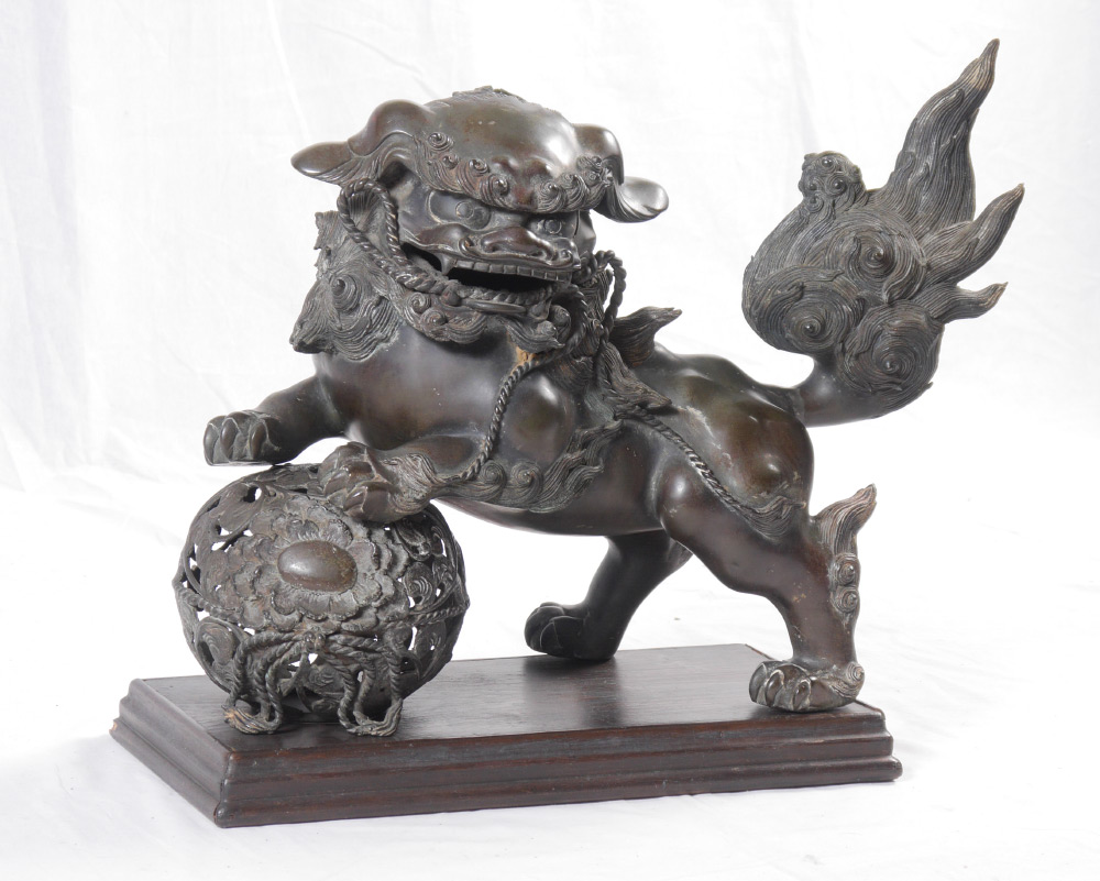 Appraisal: CHINESE BRONZE FOO DOG Patinated bronze figure of a foo