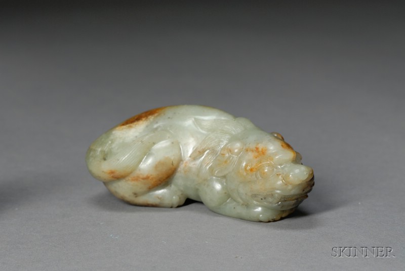 Appraisal: Jade Animal celadon stone with russet areas carved as a