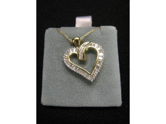 Appraisal: Diamond Heart Pendant baguette cut diamonds totaling carat in k