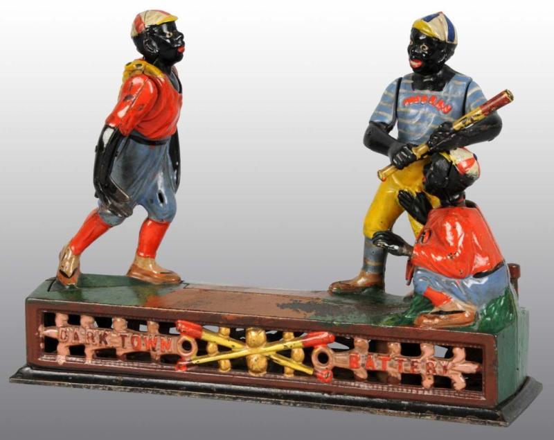 Appraisal: Cast Iron Dark Town Battery Mechanical Bank Description Manufactured by