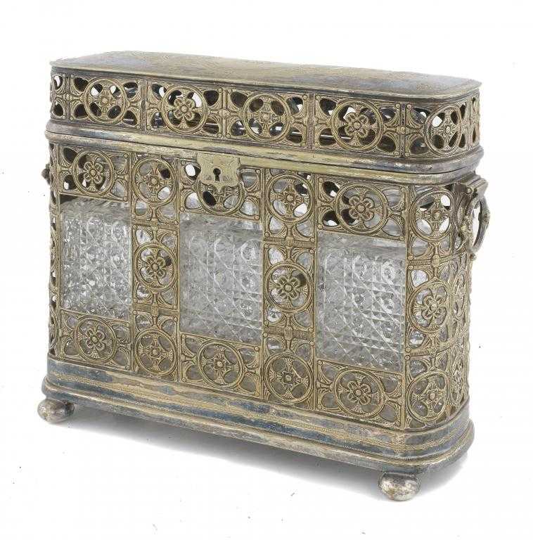 Appraisal: A VICTORIAN TANTALUS with hinged handles and engraved lid the