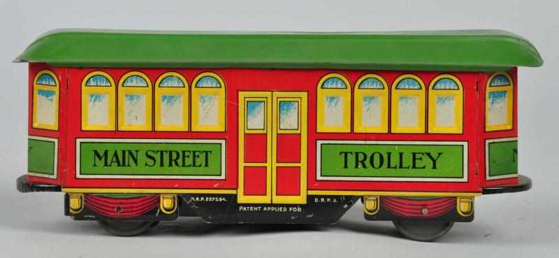 Appraisal: Tin Nifty Main Street Trolley Wind-Up Toy Description German Working