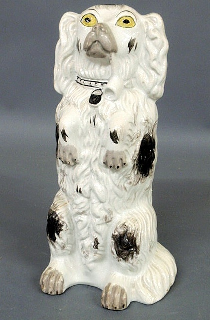 Appraisal: Rare Staffordshire pipe smoking spaniel sitting on its hind legs