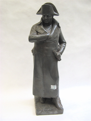 Appraisal: A NAPOLEON PLASTER SCULPTURE standing with right-hand inside coat at